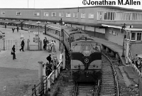 With its distinctive front vents, 181 Class locomotive No.186 pulls out of Carlisle Pier Station in July 1980. The small windowed box structure on the platform adjacent to the crossing to the right of the photo was the 1962 built signal cabin. ©Jonathan M.Allen